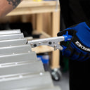 This is an image of a gloved hand using Kincrome metal bending tool on steel panels at Kennedys Welding Supplies, Derwent Park TAS, tool shop and welding specialists.