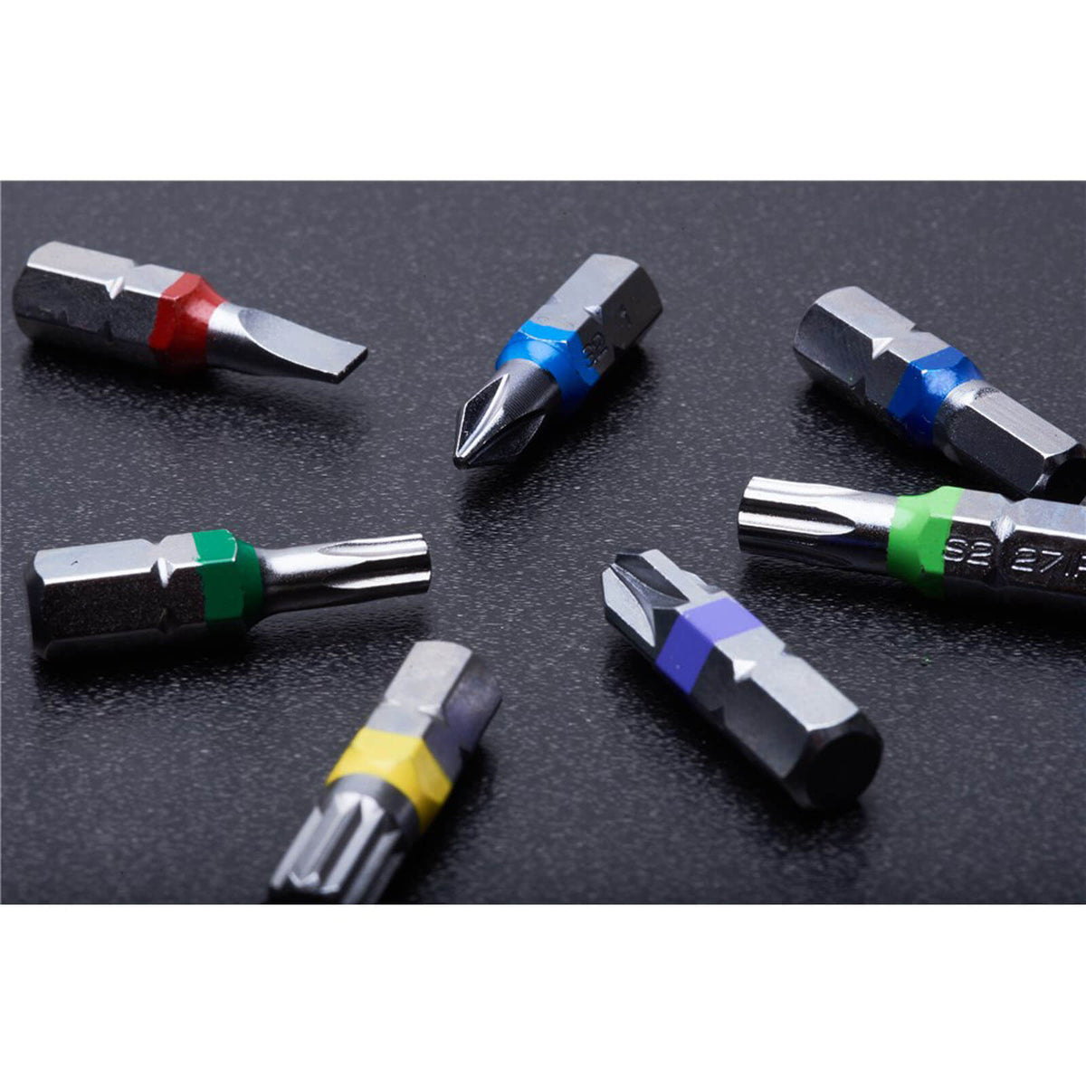 This is an image of assorted metal screwdriver bits with colored bands by Kennedys Welding Supplies in Derwent Park TAS, tool shop and welding specialists