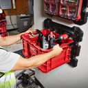 This is an image of a red Milwaukee tool box being pulled from a wall-mounted holder at Kennedys Welding Supplies in Derwent Park TAS, showcasing tool storage in their tool shop.