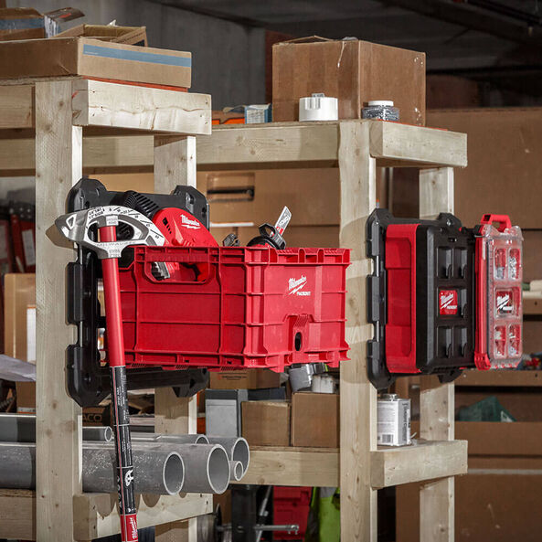 This is an image of Milwaukee power tools and storage organized on wooden shelves at Kennedys Welding Supplies in Derwent Park TAS, offering Tool Shop and Power Tool Repairs