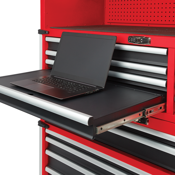 This is an image of a laptop on a pull-out work surface of a red tool cabinet, showcasing welding and tool shop supplies at Kennedys Welding Supplies in Derwent Park, TAS