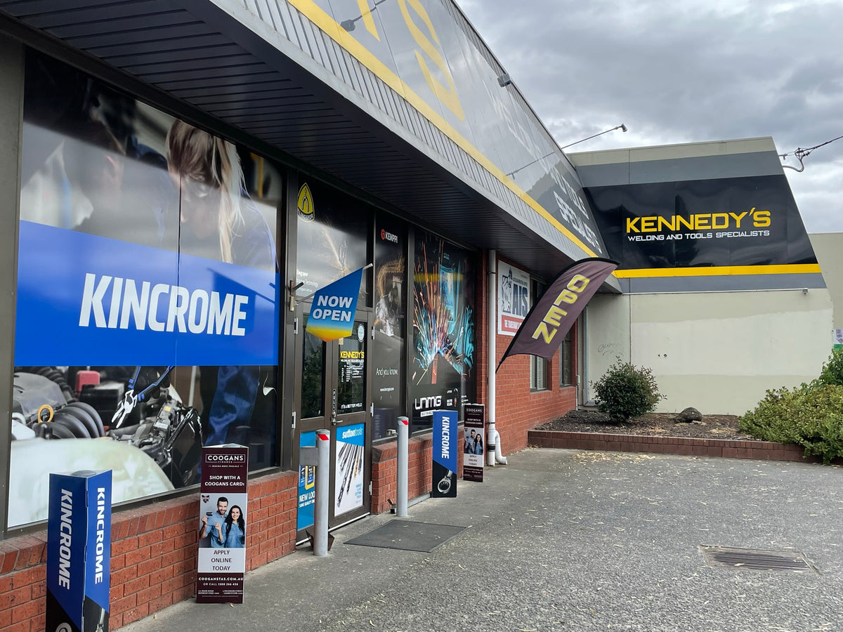 This is an image of Kennedys Welding Supplies store exterior in Derwent Park TAS showing signs for Kincrome and open flag, specializing in welding and tool shop services