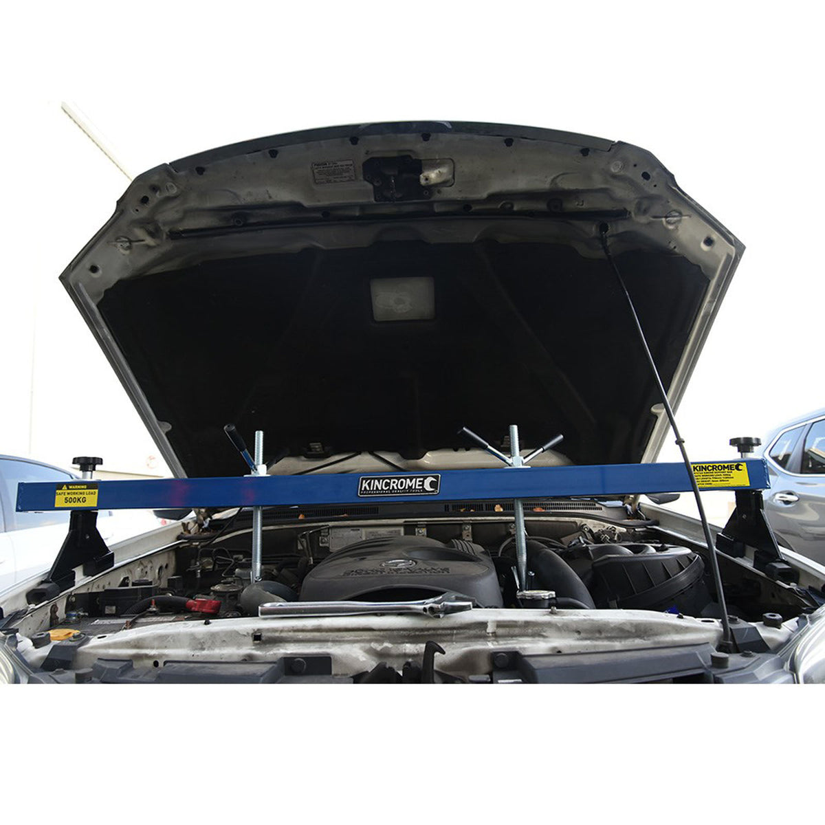 This is an image of a Kincrome engine support bar installed on a vehicle engine bay at Kennedys Welding Supplies in Derwent Park TAS offering tool shop and welding specialist services.