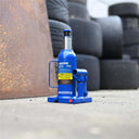This is an image of a blue Kincrome 4000kg hydraulic bottle jack on concrete, at Kennedys Welding Supplies in Derwent Park TAS, offering tool shop, welding specialists, and power tool repairs