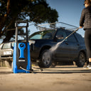 This is an image of a blue Kincrome pressure washer cleaning a black SUV, representing Kennedys Welding Supplies in Derwent Park TAS, offering tool shop and welding specialist services