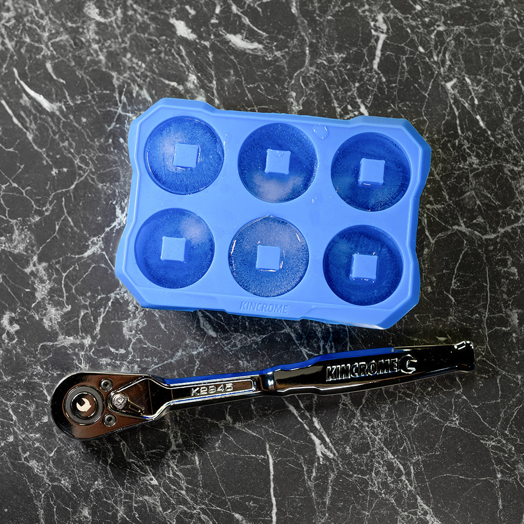 This is an image of a Kincrome ratchet wrench and a blue ice cube tray on a black marble surface, Kennedys Welding Supplies, Derwent Park TAS