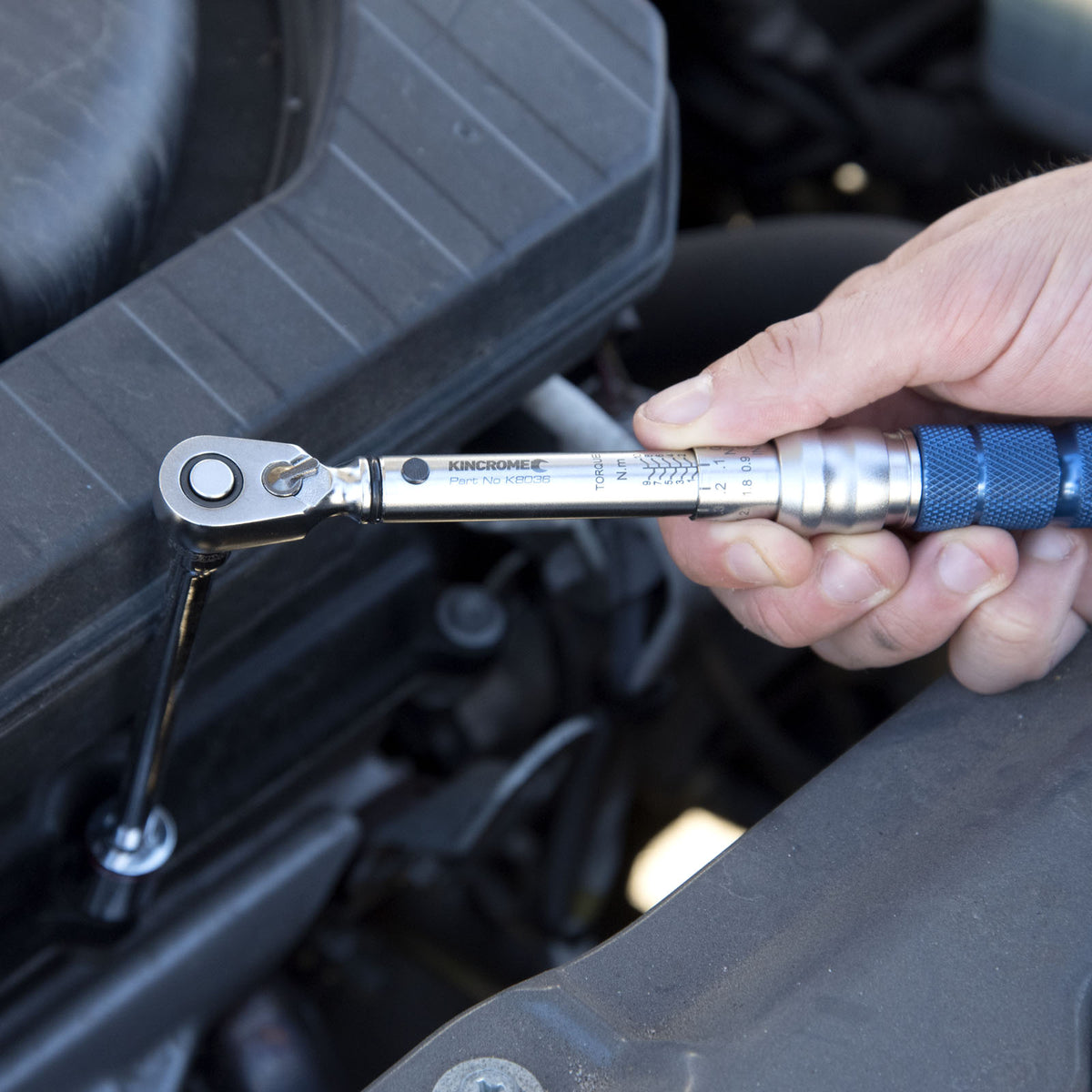 This is an image of a hand using a Kincrome torque wrench for automotive repair, featured by Kennedys Welding Supplies in Derwent Park TAS, offering tool shop, welding specialists, and power tool repairs.