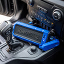 This is an image of a Kincrome branded portable power bank charging inside a vehicle console, offered by Kennedys Welding Supplies in Derwent Park TAS, specializing in tool shop, power tool repairs, and welding specialists.