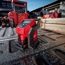 This is an image of a red Milwaukee tool in a truck bed with timber, boots, and toolboxes at Kennedys Welding Supplies in Derwent Park TAS