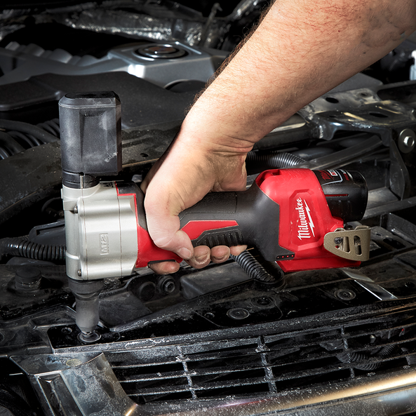 This is an image of a person using a Milwaukee power tool under a car hood, showcasing Kennedys Welding Supplies in Derwent Park TAS with tool shop and welding specialists services