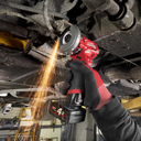 This is an image of a person using a Milwaukee M12 cordless angle grinder producing sparks, showcasing welding and power tool repair at Kennedys Welding Supplies in Derwent Park, TAS