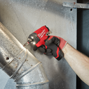 This is an image of a hand using a Milwaukee M12 FID20 fuel power tool on metal ducting, by Kennedys Welding Supplies in Derwent Park TAS