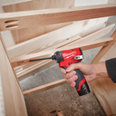 This is an image of a hand holding a Milwaukee cordless screwdriver driving screws in wood, featured by Kennedys Welding Supplies in Derwent Park TAS, offering tool shop and power tool repairs