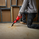 This is an image of a person using a red Milwaukee handheld power tool on concrete floor, showcasing tools available at Kennedys Welding Supplies in Derwent Park, TAS