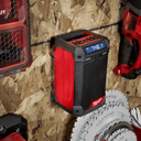This is an image of a Milwaukee portable Bluetooth worksite radio mounted on a workshop wall at Kennedys Welding Supplies in Derwent Park, TAS, offering tool shop, laser cutting, power tool repairs, and welding specialists
