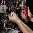 This is an image of hands using a Milwaukee power tool for electrical wiring repair at Kennedys Welding Supplies in Derwent Park TAS, offering tool shop and power tool repairs