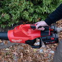 This is an image of a Milwaukee cordless leaf blower held by a person, promoting Kennedys Welding Supplies in Derwent Park TAS with tool shop and power tool repairs