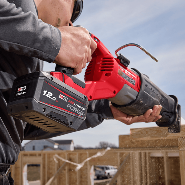 This is an image of a person using a Milwaukee M18 REDLITHIUM cordless saw at a construction site, showcasing power tools from Kennedys Welding Supplies in Derwent Park TAS offering tool shop and power tool repairs