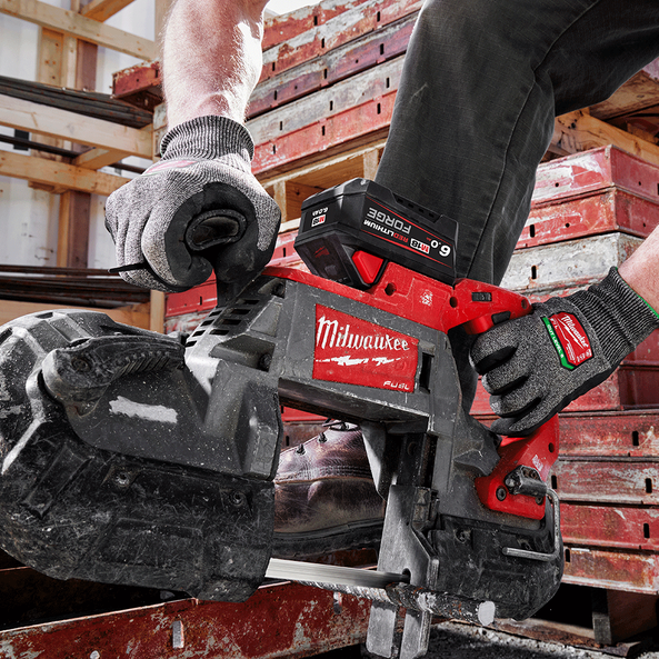 This is an image of a person using a Milwaukee power tool on a construction site, showcasing Kennedys Welding Supplies in Derwent Park, TAS, offering tool shop, power tool repairs, welding specialists, and onsite tool truck services.