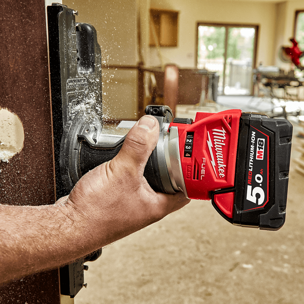 This is an image of a hand using a Milwaukee M18 Fuel cordless cutting tool cutting metal at Kennedys Welding Supplies in Derwent Park TAS, offering tool shop and welding specialists services.