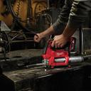 This is an image of a person using a Milwaukee power tool on metal equipment at Kennedys Welding Supplies in Derwent Park, TAS offering tool shop and welding specialist services