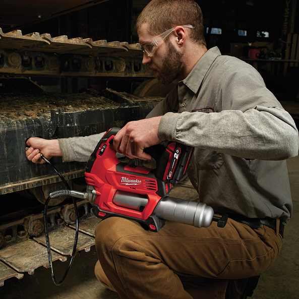 This is an image of a man using a red Milwaukee power tool in an industrial setting at Kennedys Welding Supplies tool shop in Derwent Park, Tasmania
